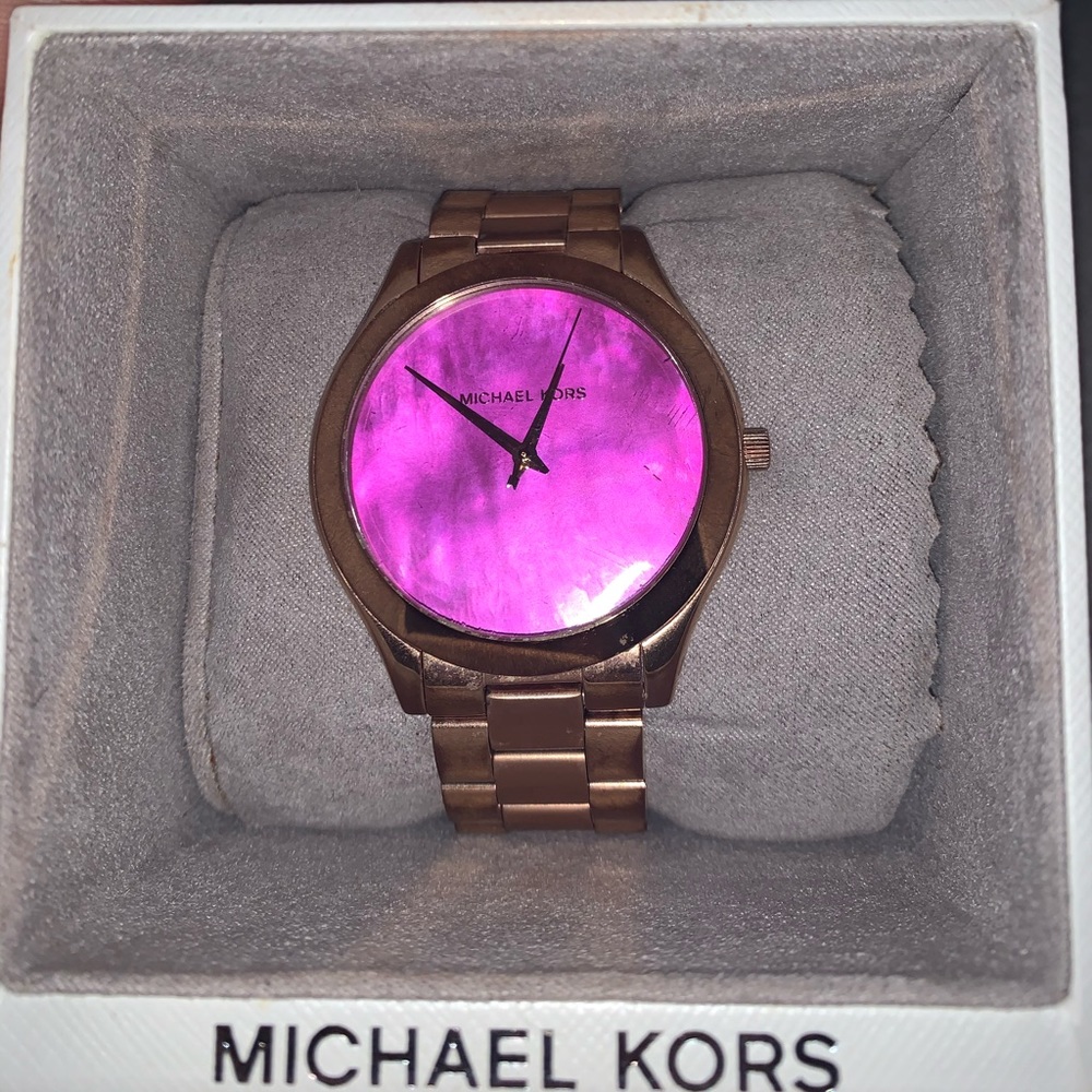 Michael Kors pink face watch.